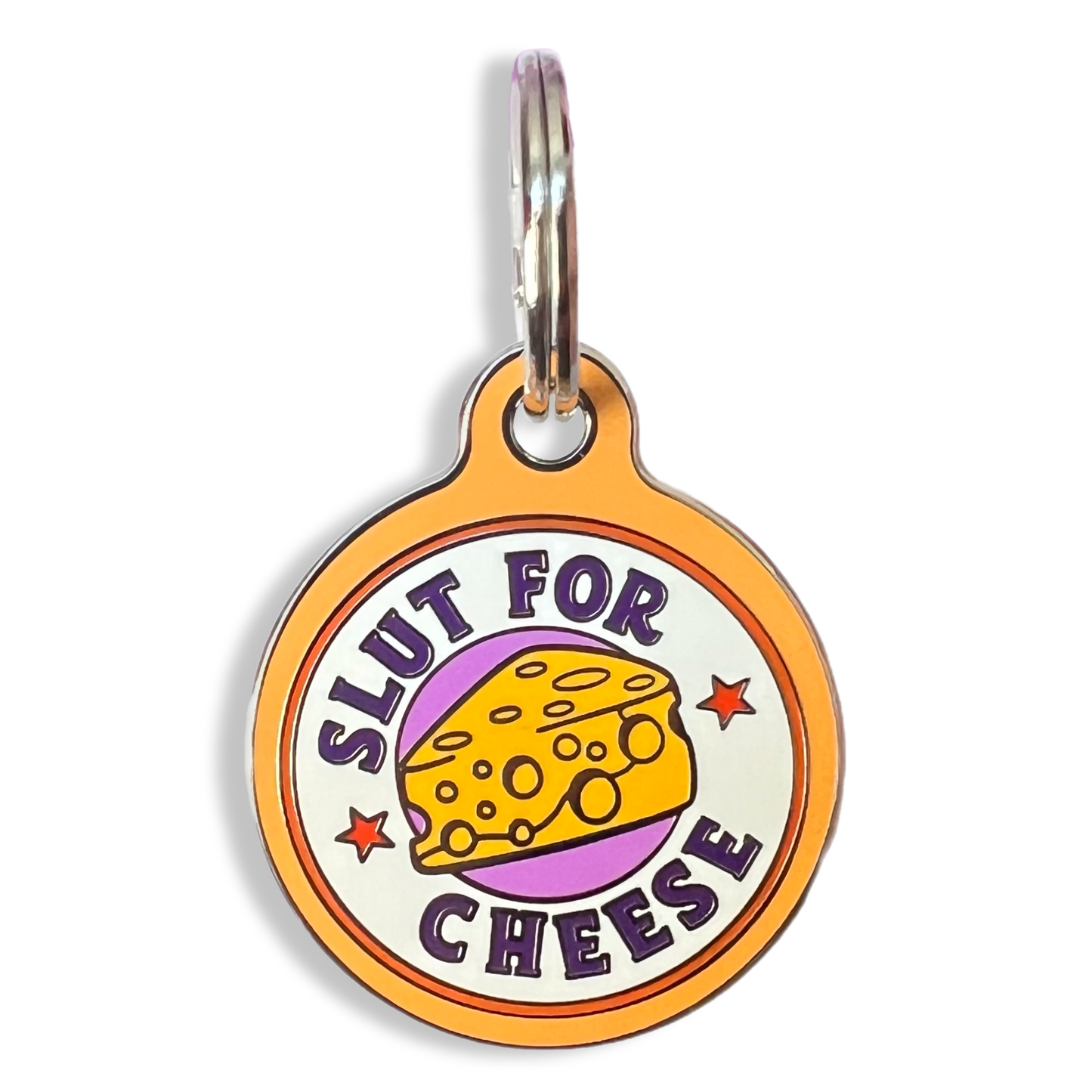 A humorous dog tag displaying the phrase "slut for cheese," showcasing a playful take on pet accessories.