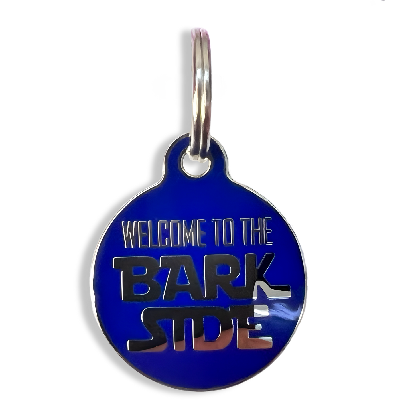 A playful pet tag that reads "Welcome to the Bark Side," perfect for showcasing a dog's personality and charm.