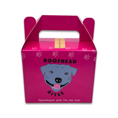 A pink box featuring a playful dog face design, adding a whimsical touch to any setting.