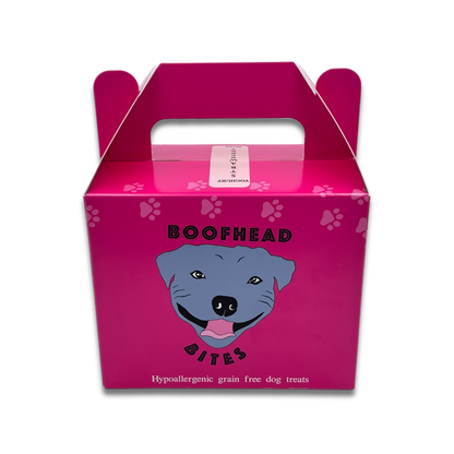 A pink box featuring a playful dog face design  that resembles a Staffordshire bull terrier, adding a whimsical touch to any setting